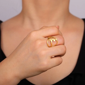 Artistic 18K gold-plated stainless steel hollow ring featuring Arabic calligraphy on finger