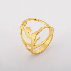 Detailed view of hollowed-out gymnast silhouette on 18K gold plated steel ring