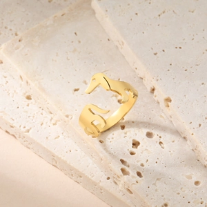 Polished gold adjustable open ring featuring a minimalist dachshund dog animal shape