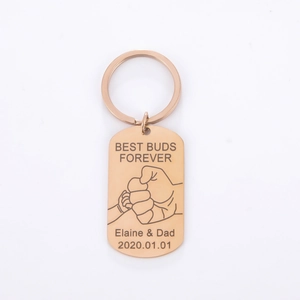 Detail of rose gold custom keychain with Best Buds Forever engraving and fist bump icon