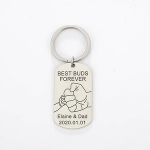Detail view of engraved stainless steel keychain with Best Buds Forever fist bump design