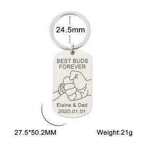 Close-up of stainless steel keychain with Best Buds Forever text and fist bump engraving