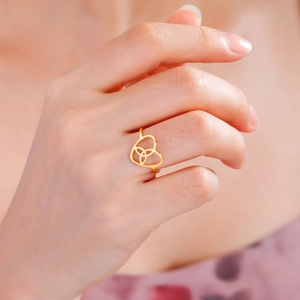 Gold Celtic knot heart ring in stainless steel for women featuring a minimalist cutout design