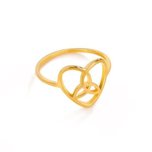 Macro detail of golden Celtic Triquetra knot nested inside a heart-shaped steel ring band