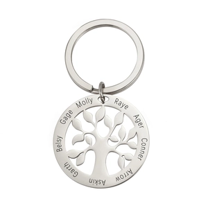 Custom stainless steel keychain featuring a hollow tree of life pendant and laser engraved names