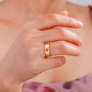 Golden stainless steel four-leaf clover ring for women featuring a minimalist cutout design