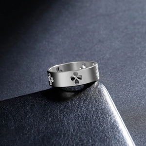 Polished silver stainless steel open ring featuring minimalist clover heart cutouts