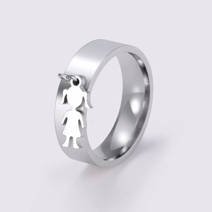 Polished stainless steel wide ring featuring a dangling cartoon girl pendant accessory