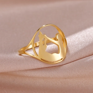 Macro shot of gold stainless steel ring with laser cut mother and child silhouette