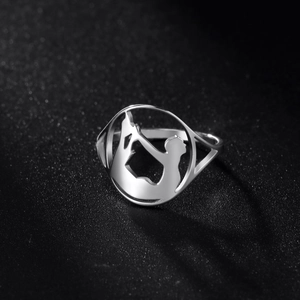 Polished stainless steel ring featuring a cutout yoga silhouette on a black background