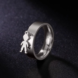 Detailed view of silver stainless steel ring featuring a minimalist boy charm pendant