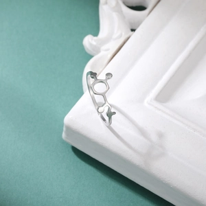 Macro shot of silver stainless steel ring with a unique chemical molecule design