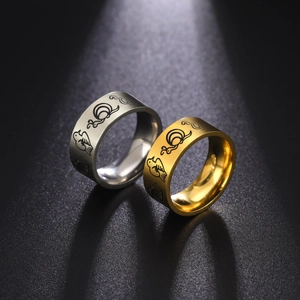 Golden and silver 8mm stainless steel animal engraved rings for couples on black background