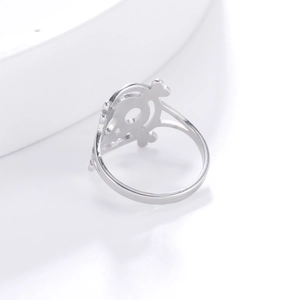 Detailed view of hollow gothic silver stainless steel pirate skull ring on white stand