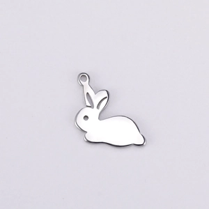 Detailed view of mirror polished stainless steel rabbit pendant with hollow eye detail