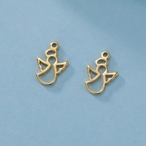 Close-up of two golden hollow angel charms for DIY jewelry on light blue background