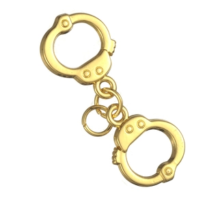 Macro shot of gold zinc alloy handcuff pendants for creative jewelry making and DIY designs