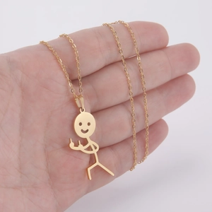 Close-up of golden stickman necklace with middle finger gesture on a hand
