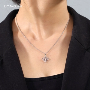 DIY stainless steel necklace featuring a silver double Celtic witch knot pendant on a model