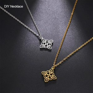 Close-up of gold and silver Celtic knot pendants on black textured background