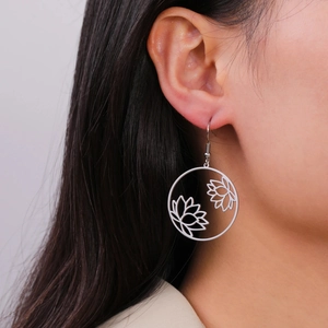 Sleek stainless steel circular lotus pendant earrings with hollow laser-cut design