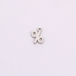 Close-up of a percent symbol pendant with polished finish for jewelry making
