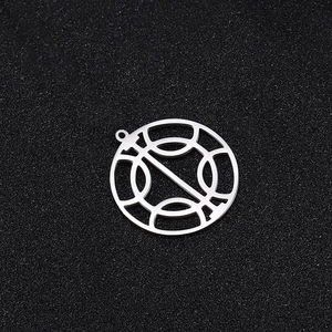 Close-up of a silver stainless steel hollow geometric pendant on a black texture