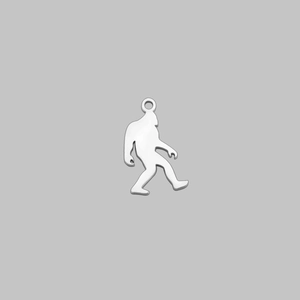 Close-up of a silver polished Bigfoot Sasquatch metal pendant with integrated loop