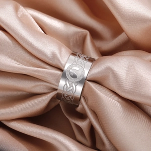 Close-up of a silver stainless steel ring with wolf totem and Celtic knot details