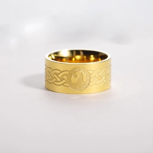 Macro shot of 18K gold-plated stainless steel ring with wolf and moon relief