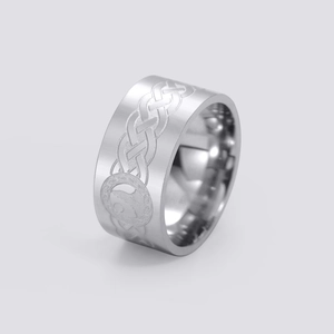 Detailed view of wide stainless steel ring with Celtic knot patterns and animal totem