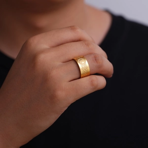 Close-up of 10mm gold stainless steel ring with Celtic knot patterns and moon totem