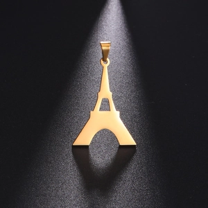 Macro shot of gold Eiffel Tower pendant in stainless steel with polished finish and shadow