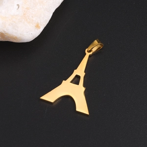 Detailed view of polished gold Eiffel Tower pendant with top ring on black background