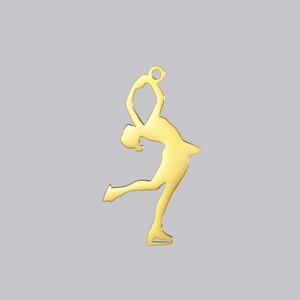 Macro view of polished gold figure skater pendant showing elegant motion and smooth finish