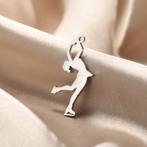 Polished stainless steel figure skating pendant on premium champagne silk fabric