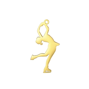 Close-up of golden stainless steel ice skater charm with polished finish for jewelry