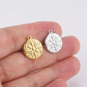 Retro stainless steel sun pendant in gold and silver finish with textured sunburst design
