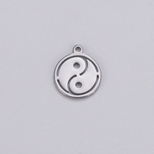 Detailed view of silver hollowed-out Tai Chi pendant with a top hanging loop for jewelry