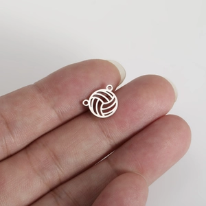 Detailed view of volleyball pendant with dual connectors for DIY jewelry making