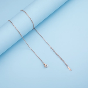 Detail of rose gold stainless steel cable chain with lobster clasp and teardrop tag