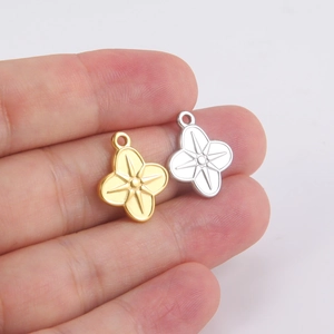 Polished stainless steel four-leaf clover pendants in gold and silver with star engraving