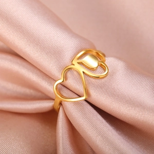 Polished golden stainless steel ring featuring a stylish hollow double heart design