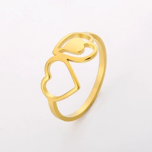 Detail of gold hollow heart ring with overlapping double hearts and polished finish
