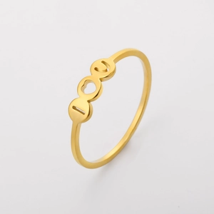 Detailed close-up of golden stainless steel ring featuring cutout I love U lettering