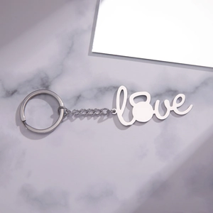 Detailed macro view of the silver stainless steel kettlebell Love pendant keychain