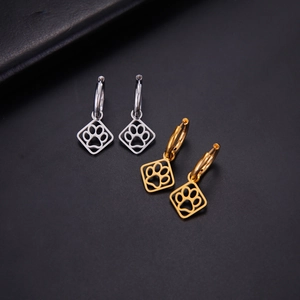 Polished stainless steel hoop earrings with cutout paw print pendants in gold and silver