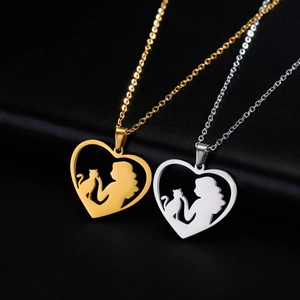 Golden and silver heart pendant necklaces featuring woman and cat silhouette design