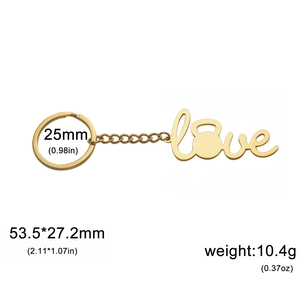 Golden stainless steel LOVE keychain with kettlebell O pendant on white background