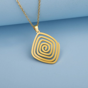Detailed view of the gold spiral swirl pendant with sleek minimalist metal chain link